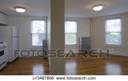Empty apartment with hardwood floor and small kitchen View Large Photo Image Stock Photo - Empty apartment with hardwood floor and small kitchen. Fotosearch