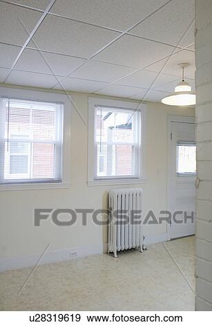 Empty Apartment With Tile Floor And A Heater Stock Photo U28319619 Empty Apartment With Tile Floor And A Heater
