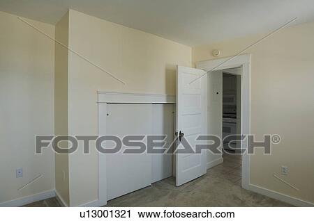 Empty room in apartment with carpeting View Large Photo Image Stock Image - Empty room in apartment with carpeting. Fotosearch