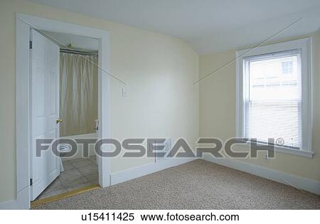 Stock Photography - Empty room in apartment with carpeting. Fotosearch