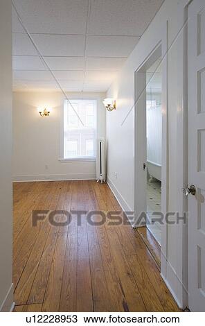 Empty room in apartment with hardwood floor View Large Photo Image Stock Image - Empty room in apartment with hardwood floor. Fotosearch