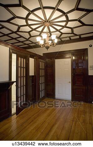 Stock Image - Empty room in apartment with hardwood floor. Fotosearch