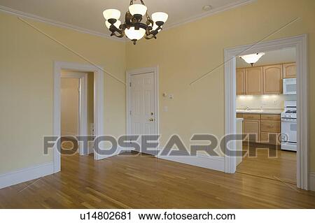 Stock Image - Empty room in apartment with hardwood floor. Fotosearch