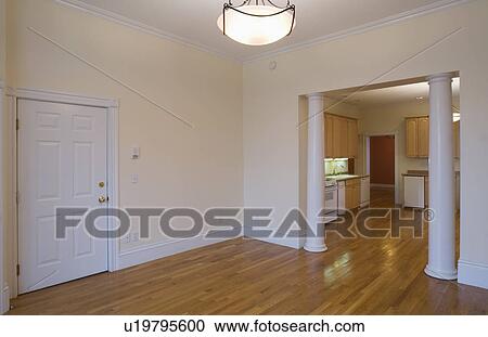 Stock Image - Empty room in apartment with hardwood floor. Fotosearch