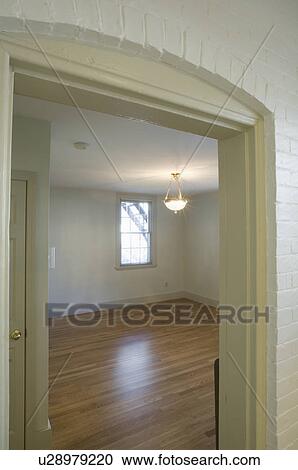 Empty room in apartment with hardwood floor View Large Photo Image Stock Image - Empty room in apartment with hardwood floor. Fotosearch