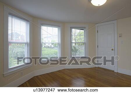 Empty room in apartment with hardwood floor View Large Photo Image Stock Photo - Empty room in apartment with hardwood floor. Fotosearch
