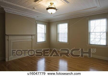 Stock Photo - Empty room in apartment with hardwood floor. Fotosearch