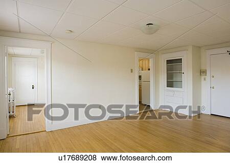 Stock Photo - Empty room in apartment with hardwood floor. Fotosearch
