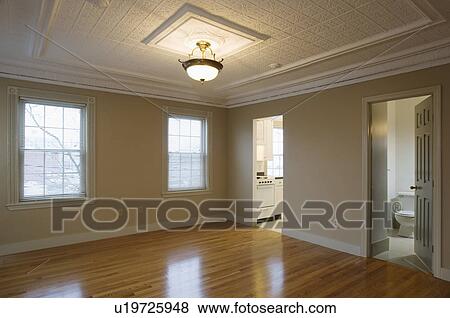 Empty room in apartment with hardwood floor View Large Photo Image Stock Photo - Empty room in apartment with hardwood floor. Fotosearch