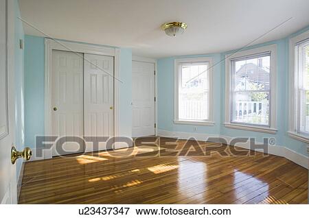 Stock Photo - Empty room in apartment with hardwood floor. Fotosearch