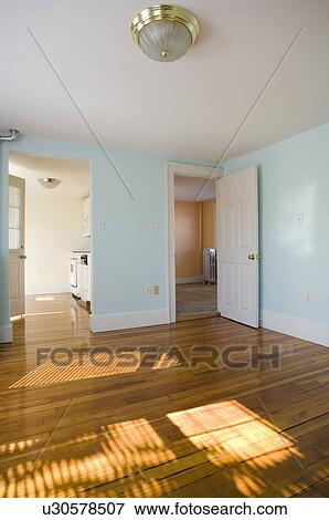 Empty room in apartment with hardwood floor View Large Photo Image Stock Photo - Empty room in apartment with hardwood floor. Fotosearch