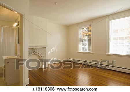 Empty room in apartment with hardwood floor View Large Photo Image Stock Photograph - Empty room in apartment with hardwood floor. Fotosearch