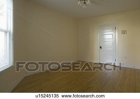 Empty room in apartment with hardwood floor View Large Photo Image Stock Photography - Empty room in apartment with hardwood floor. Fotosearch