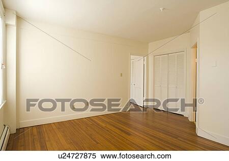 Stock Photography - Empty room in apartment with hardwood floor. Fotosearch