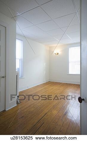 Empty room in apartment with hardwood floor View Large Photo Image Stock Photography - Empty room in apartment with hardwood floor. Fotosearch
