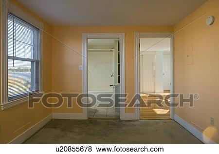 Stock Photo - Empty room with doorways to bathroom and living room. Fotosearch