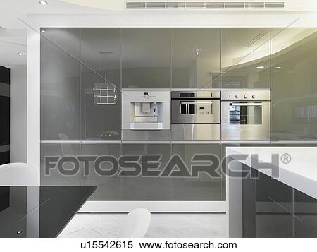 Espresso maker and oven built in to kitchen wall View Large Photo Image Stock Photography - Espresso maker and oven built in to kitchen wall. Fotosearch
