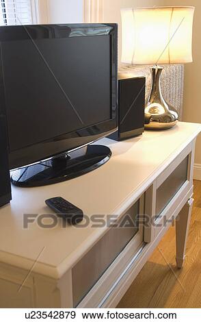 Flat screen TV on wooden table View Large Photo Image Stock Photo - Flat screen TV on wooden table. Fotosearch