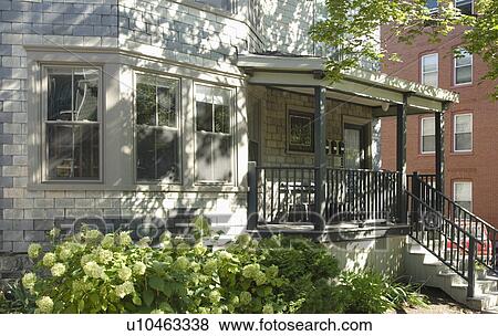 Front porch on gray brick home View Large Photo Image Stock Photo - Front porch on gray brick home. Fotosearch