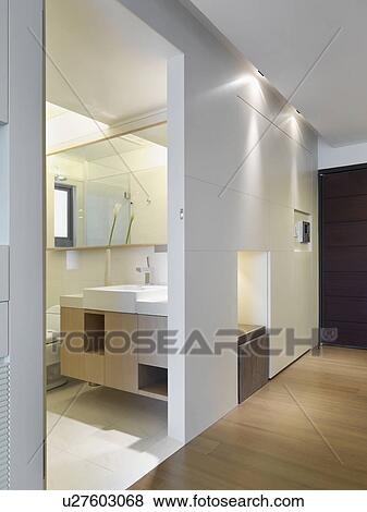 Stock Photo - Hallway and doorway leading to modern bathroom. Fotosearch