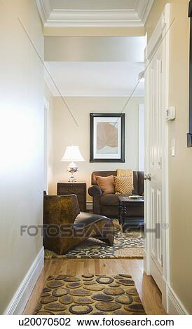 Hallway leading to contemporary living room View Large Photo Image Stock Image - Hallway leading to contemporary living room. Fotosearch