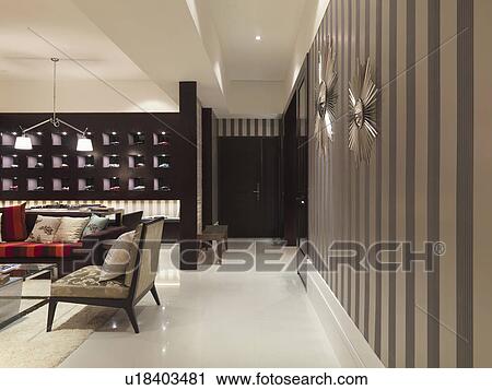 Stock Image - Hallway with striped wall paper in modern home. Fotosearch