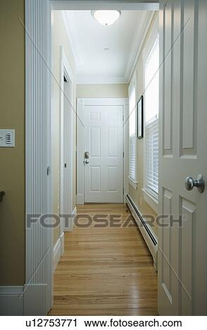 Stock Image - Hardwood floor in hallway. Fotosearch