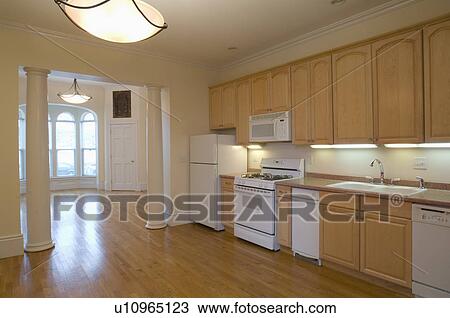 Stock Image - Hardwood floor in spacious traditional kitchen. Fotosearch