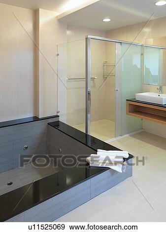 Jacuzzi tub in modern bathroom View Large Photo Image Stock Photo - Jacuzzi tub in modern bathroom. Fotosearch