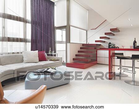 Stock Photo - Kitchen and living room in modern apartment home. Fotosearch