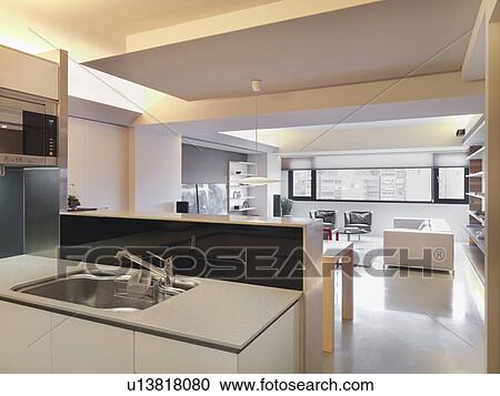 Stock Image - Kitchen sink and living room. Fotosearch