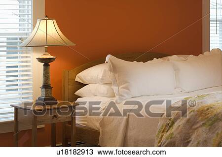 Lamp and nightstand beside bed View Large Photo Image Stock Image - Lamp and nightstand beside bed. Fotosearch