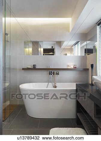 Stock Image - Large bathtub in modern bathroom. Fotosearch