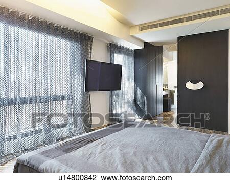 Stock Image - Large window in modern bedroom. Fotosearch