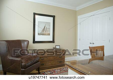 Leather wing backed chair in home office View Large Photo Image Stock Image - Leather wing backed chair in home office. Fotosearch