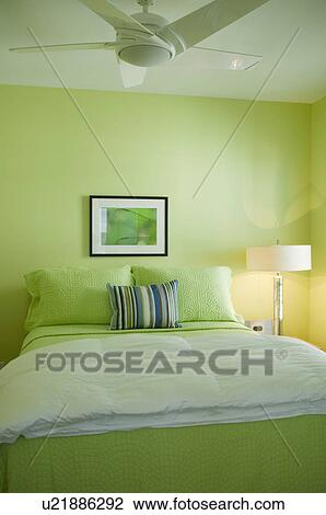 Stock Image - Lime green bedroom. Fotosearch
