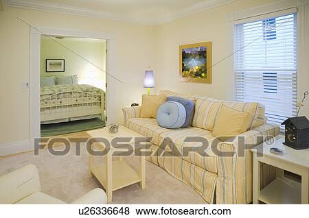 Stock Photo - Living room outside of bedroom in apartment home. Fotosearch