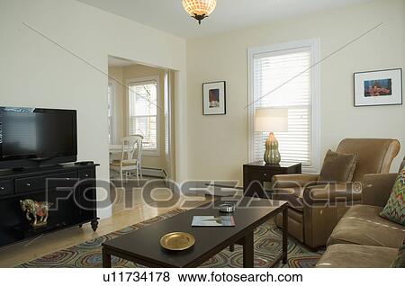 Living room with colorful area rug View Large Photo Image Stock Photo - Living room with colorful area rug. Fotosearch