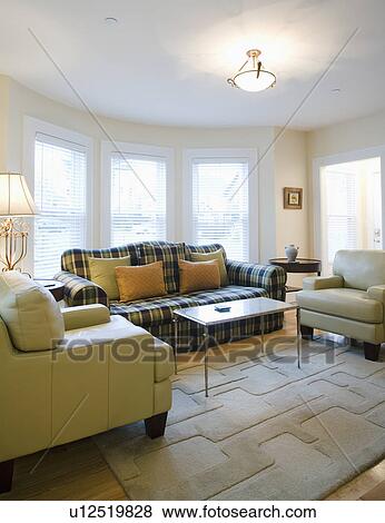 Stock Photo - Living room with plaid sofa. Fotosearch