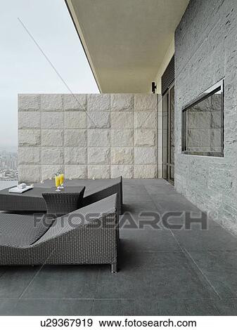 Lounge chairs on patio View Large Photo Image Stock Photo - Lounge chairs on patio. Fotosearch