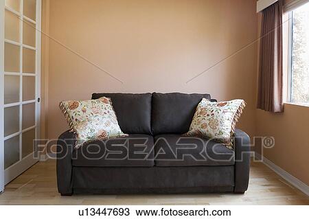 Love seat in peach colored room View Large Photo Image Stock Image - Love seat in peach colored room. Fotosearch