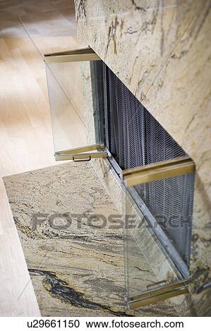 Marble fireplace with glass doors View Large Photo Image Stock Image - Marble fireplace with glass doors. Fotosearch