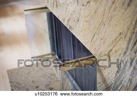 Stock Photograph - Marble fireplace with glass doors. Fotosearch