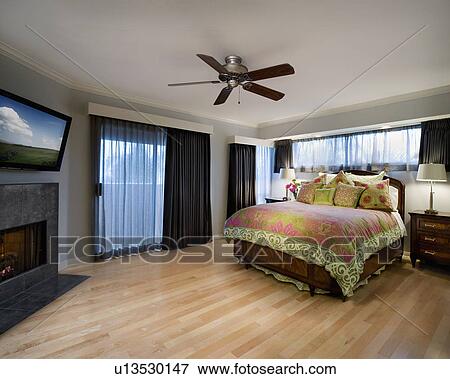 Stock Photo - Master bedroom with pink and green accents. Fotosearch
