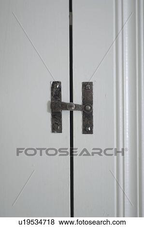 Metal latch on cabinet View Large Photo Image Stock Photo - Metal latch on cabinet. Fotosearch