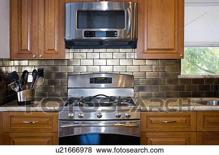 Microwave and stove in contemporary kitchen View Large Photo Image Stock Photo - Microwave and stove in contemporary kitchen. Fotosearch