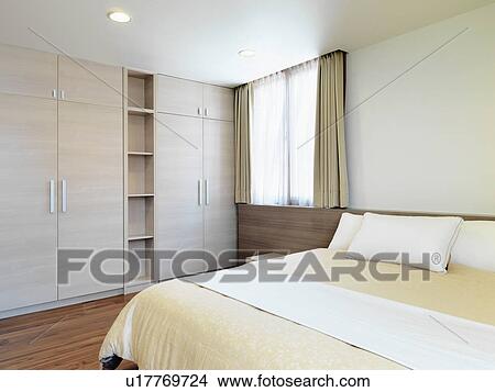 Minimalism bedroom with built in cabinets View Large Photo Image Picture - Minimalism bedroom with built in cabinets. Fotosearch