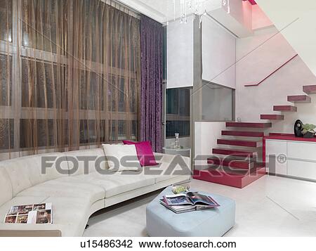 Stock Image - Minimalism home with floating staircase. Fotosearch