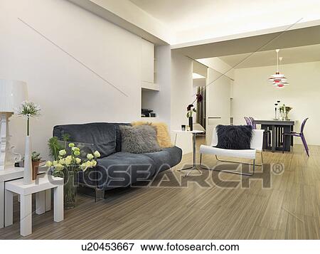 Modern living room and dining room with hardwood floors View Large Photo Image Stock Photo - Modern living room and dining room with hardwood floors. Fotosearch