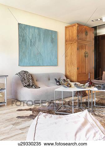 Modern living room with hardwood floor and an animal skin rug View Large Photo Image Stock Photography - Modern living room with hardwood floor and an animal skin rug. Fotosearch
